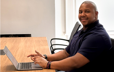 Close-up shot of smiling WCG team member in office chair