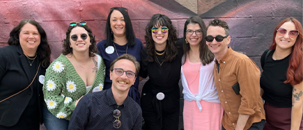 WCG team members in front of agency outdoor mural